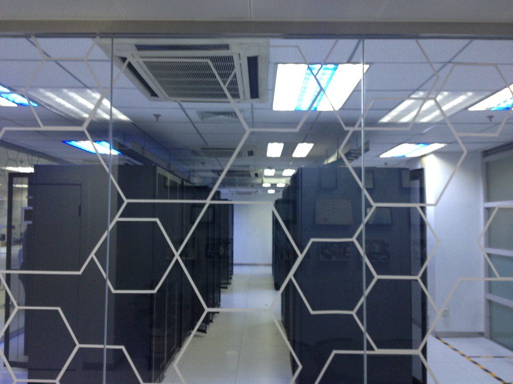 Rows of servers in a data center, grounding the AI section in real infrastructure rather than abstract graphics