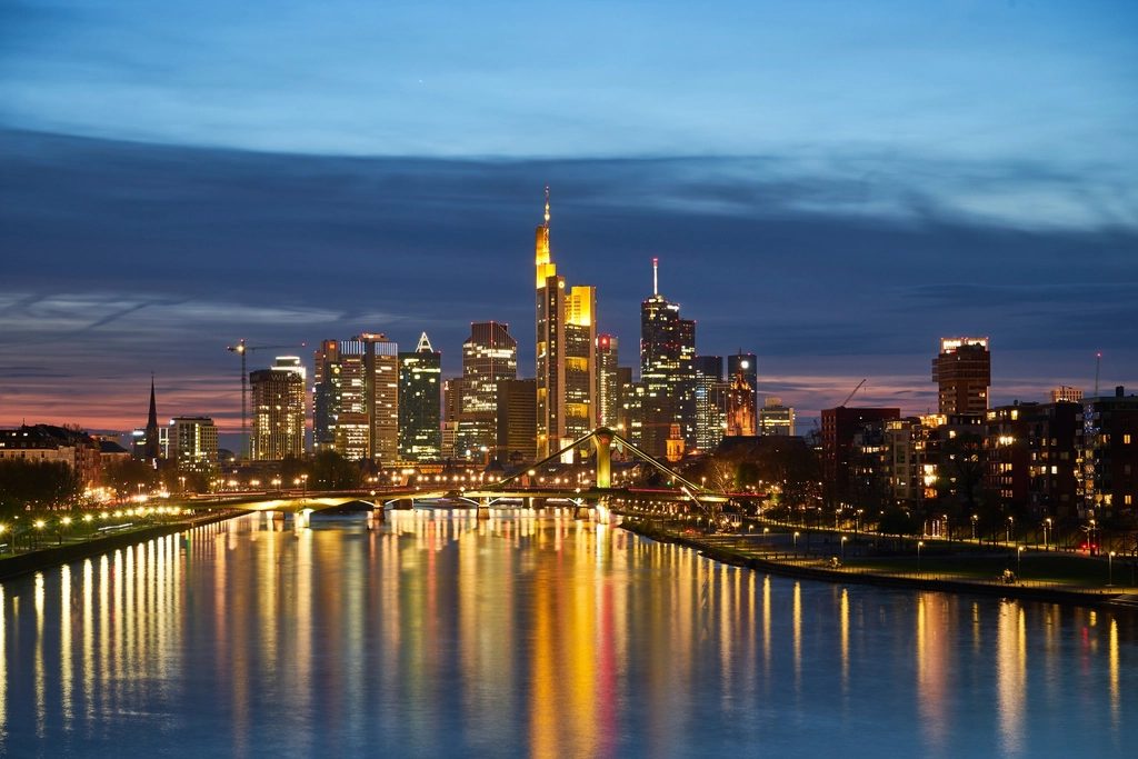 Frankfurt skyline at night, used as an editorial proxy for European market mood and deal flow